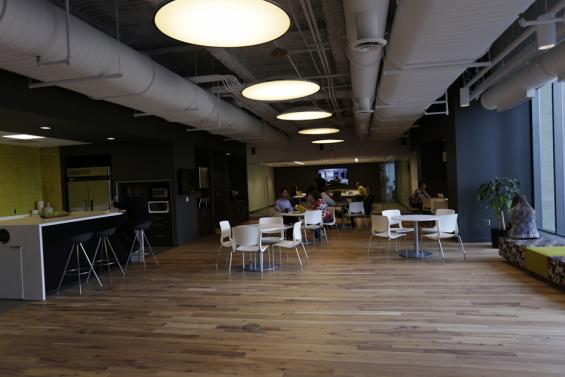 Pioneer Millworks American Gothic Hickory reclaimed wood flooring in an office space in Rochester, NY