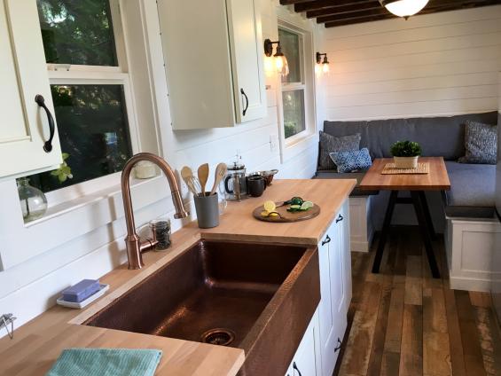 Pioneer Millworks Settlers Plank Mixed Hardwoods reclaimed wood flooring in a tiny home in Portland, OR