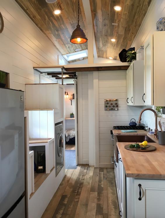 Pioneer Millworks Settlers Plank Mixed Hardwoods reclaimed wood flooring in a tiny home in Portland, OR