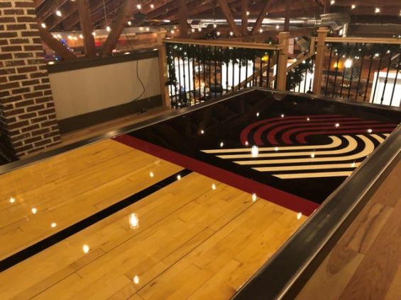 Trail Blazer Gym Flooring Slab made into a custom table for a residential home.