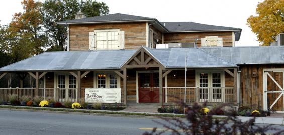 The original structure, repurposed into The Barrow House, is clad with American Prairie Brown Board.