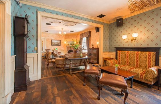 Settlers Plank Reclaimed Oak flows throughout dining and parlor areas in the Barrow House. Photo by Don Cochran Photography.