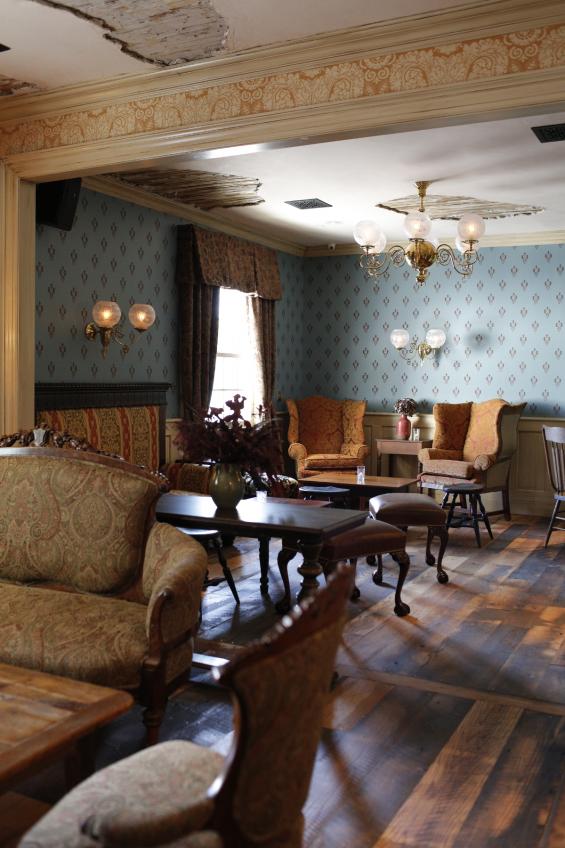 Reclaimed Settlers Plank Oak in wider boards unifies various rooms in the Barrow House.