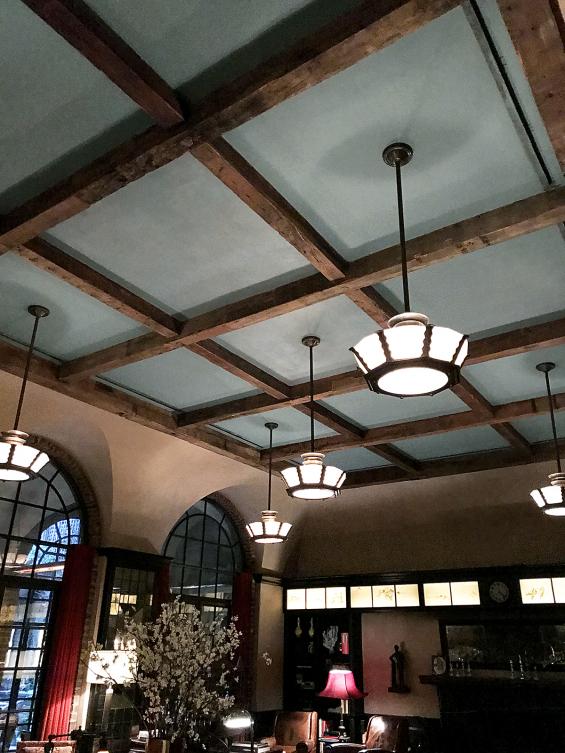 Hand-hewn timbers adorn the lobby ceiling of the Tribeca Hotel in New York City.