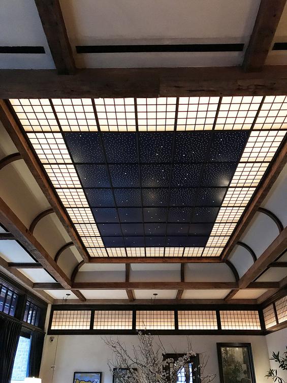 Hand-hewn timbers adorn the lobby ceiling of the Tribeca Hotel in New York City.
