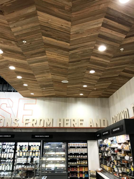 Bright Indonesian Teak is used for the chevron patterned ceiling. All wood is finished with a penetrating fire retardant.