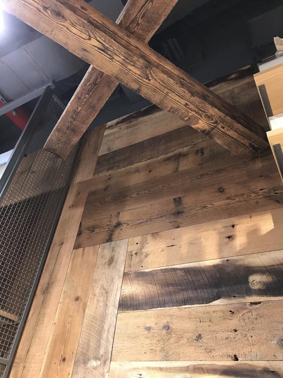 Pioneer Millworks Reclaimed Timbers and American Prairie Brownboard Paneling in Muji, Hudson Yards NYC
