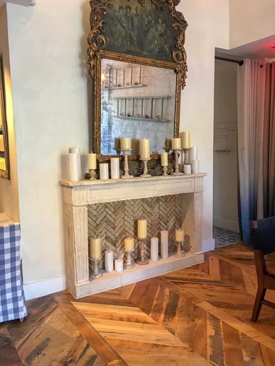 Pioneer Millworks reclaimed Settlers' Plank Mixed Hardwoods in Dolce Riviera restaurant in Dallas, Texas. Installed in a chevron pattern.