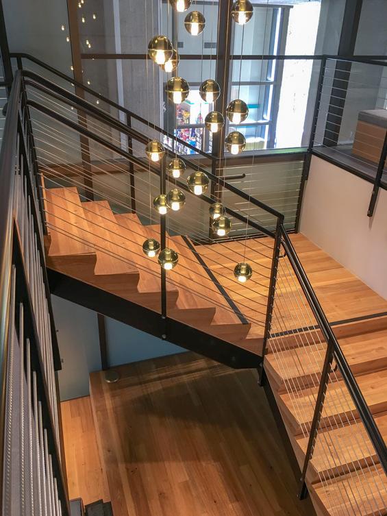 Pioneer Millworks reclaimed American Gothic Ash with poly and fire retardant used on stairs in San Fransisco, CA