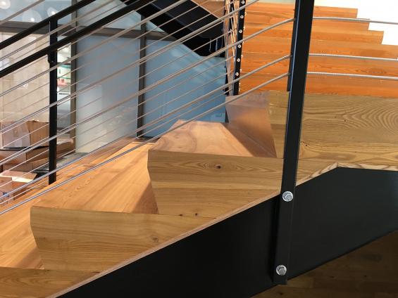 Pioneer Millworks reclaimed American Gothic Ash with poly and fire retardant used on stairs in San Fransisco, CA