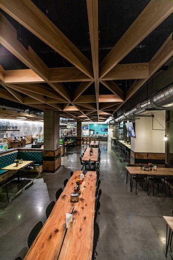 Pioneer Millworks Whole Modern Farmhouse Clean Ash accent ceiling installation with poly and fire retardant in Whole Foods, Atlanta, GA