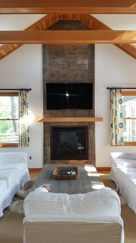 Pioneer Millworks Corral Board used as paneling around a residential fireplace. Douglas fir mantel also by Pioneer Millworks.