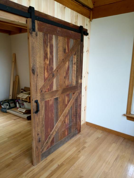 Flat Track Door-Reclaimed Softwoords with Occasional Original Red Paint Left In Tact