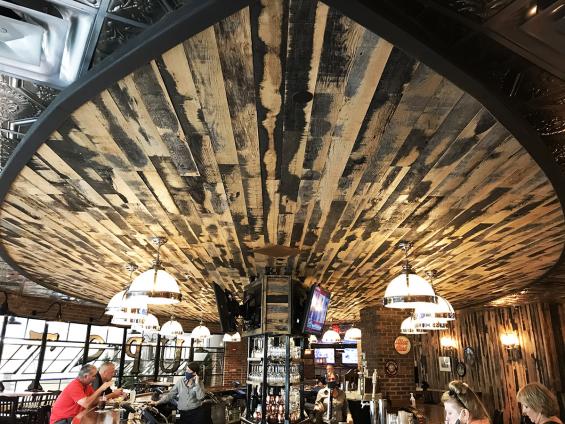 Pioneer Millworks Reclaimed Black & Tan–50/50 Oak wall paneling in Turning Stone Casino, Verona, NY.