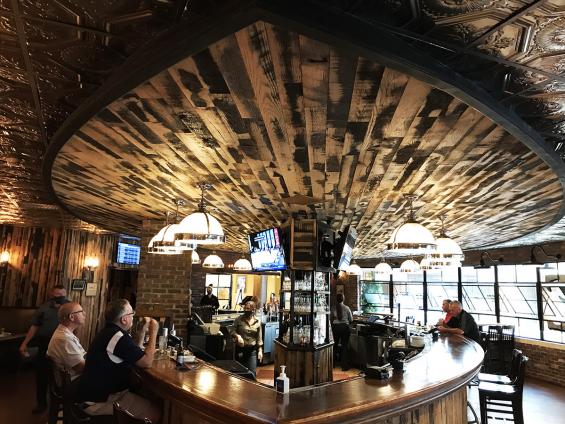 Pioneer Millworks  Reclaimed Black & Tan–50/50 Oak wall paneling.