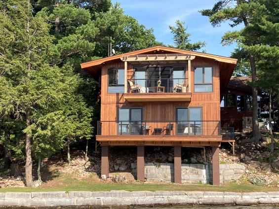 Private Residence on Alexandria Bay with Select Larch Exterior Siding wire brushed with a Light Brown non-VOC water-based penetrating sealer.