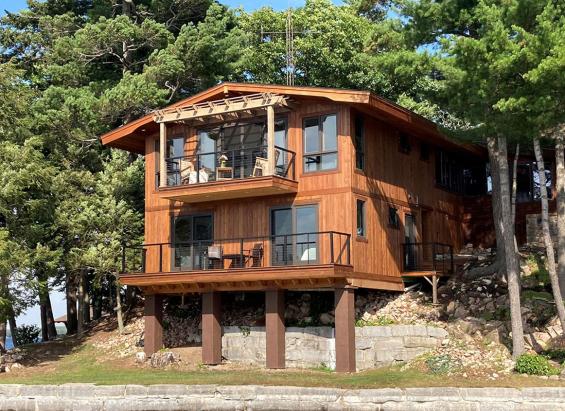 Private Residence on Alexandria Bay with Select Larch Exterior Siding wire brushed with a Light Brown non-VOC water-based penetrating sealer.