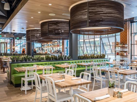 Pioneer Millworks Modern Farmhouse Clean White Oak ceiling paneling with a water based-poly finish––True Food Kitchen, Arlington, VA