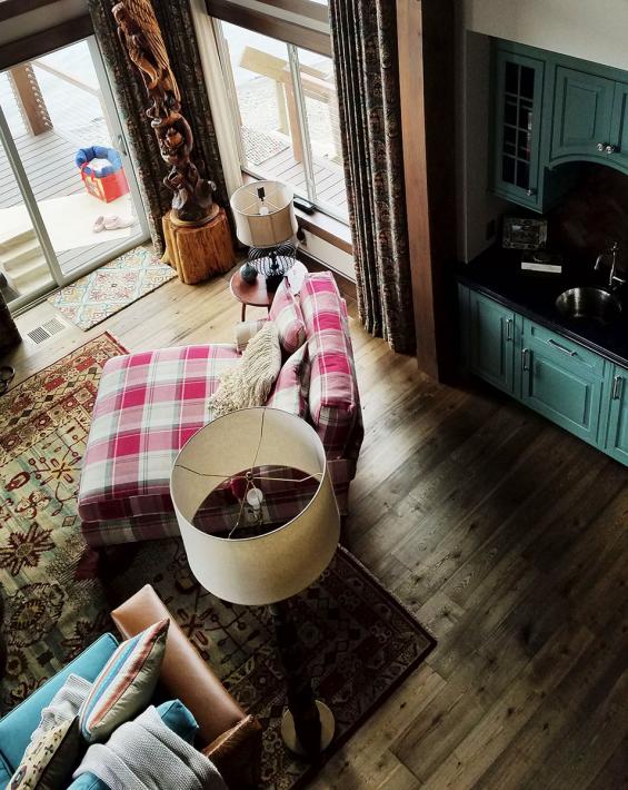 Pioneer Millworks American Gothic Ash flooring with a Castle Brown finish applied.
