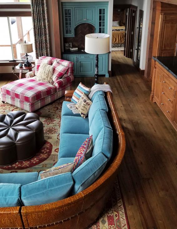 Pioneer Millworks American Gothic Ash flooring with a Castle Brown finish applied.