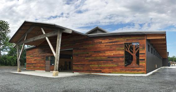 Larch Shallow Char clads the outside of our CLT building on campus with a custom color finish.