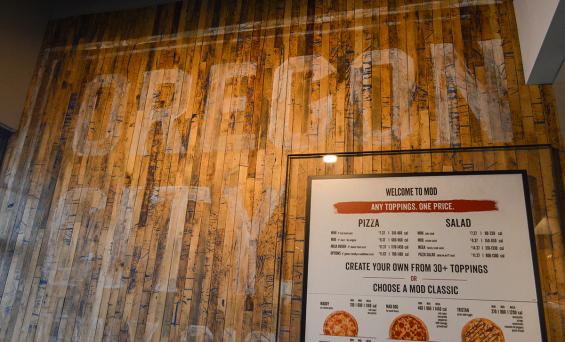 Pioneer Millworks reclaimed Foundry Maple Painted & Sanded in blue featured on this accent wall for MOD Pizza in Oregon City, OR.
