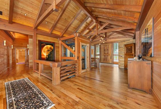 Pioneer Millworks reclaimed Black & Tan-–Tan Oak flooring & Standard Larch wall paneling.