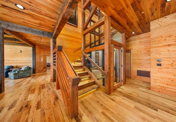 Pioneer Millworks reclaimed Black & Tan-–Tan Oak flooring & Standard Larch wall paneling.