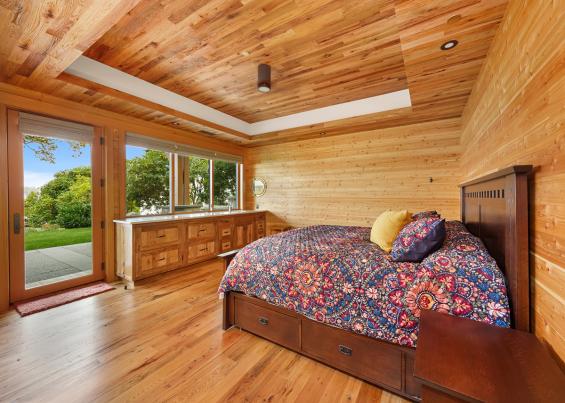 Pioneer Millworks reclaimed Black & Tan-–Tan Oak flooring & Standard Larch wall paneling.