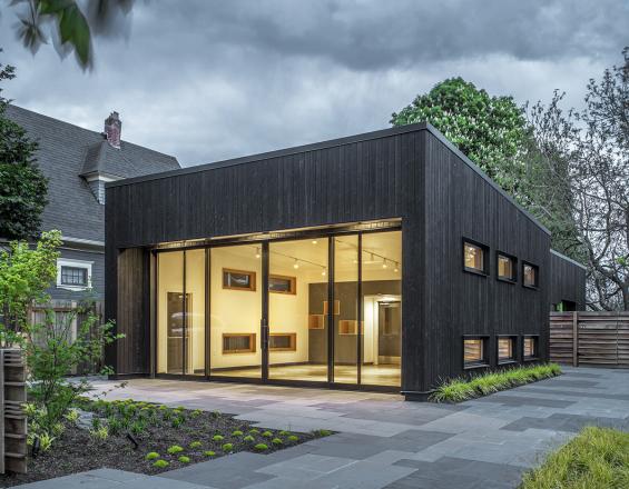 Shou Sugi Ban Larch Carbon by Pioneer Millworks. Black wood siding that is burned. Here seen as Exterior Siding at the Portland Playhouse in Portland, OR