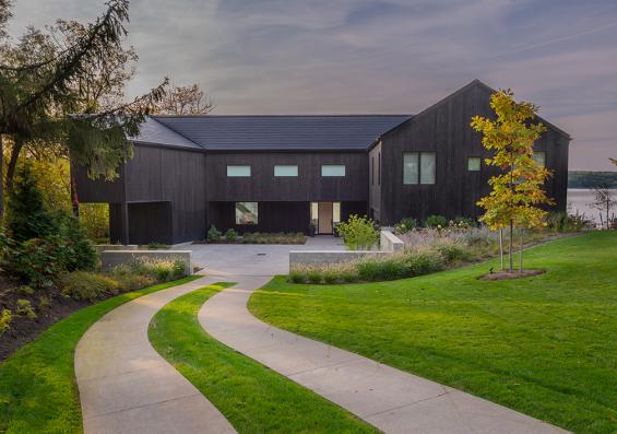 Private Residence in the Finger Lakes Region of New York featuring Pioneer Millworks Accoya Siding in Black and Sand