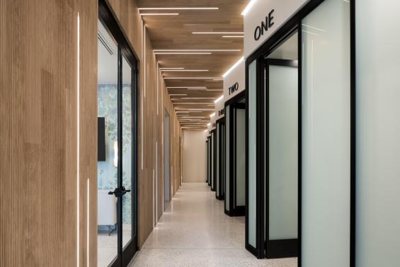 Pioneer Millworks Raked Oak in The Skin Center, Ohio. Photos by Kate Horgan Photography.