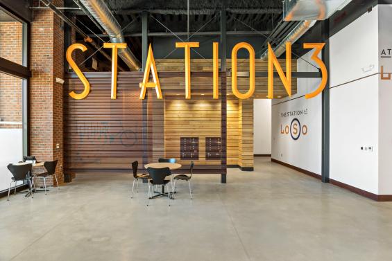 Pioneer Millworks American Gothic Ash with Pure Finish Paneling in The Stations at LoSo Charlotte, NC. Photo by VISIO Photography.